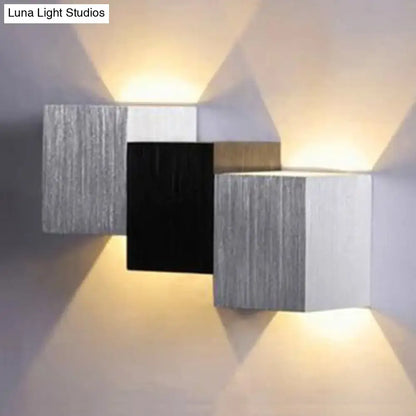 Modern cubic silver and black direct wired electric wall sconce with brushed metallic finish and maximum bulb wattage use