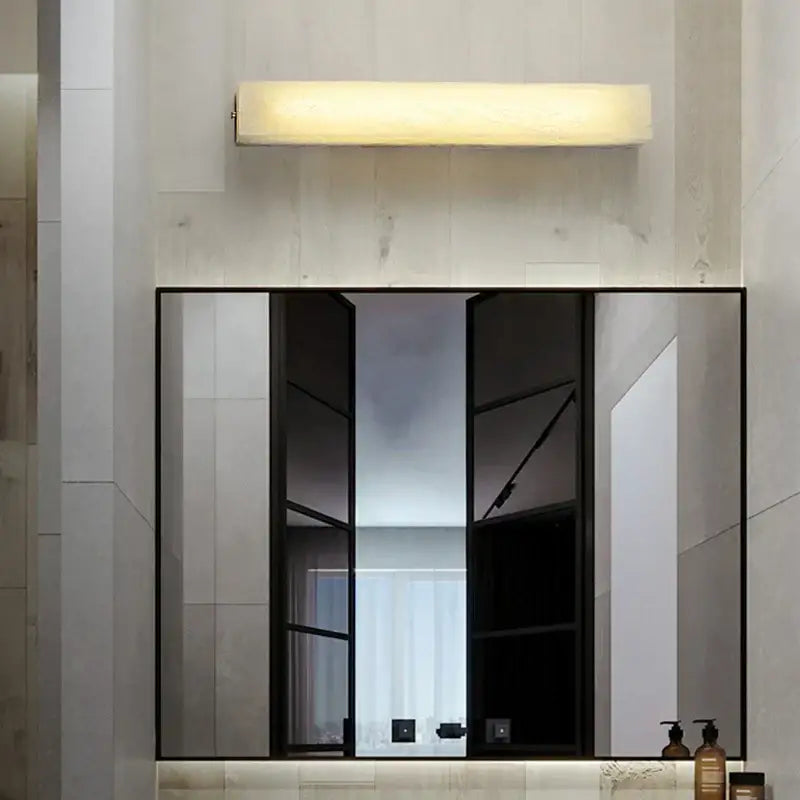 Modern cuboid marble led wall lamp with sleek metallic finish and warm diffused glow by decorbites for bedroom lighting