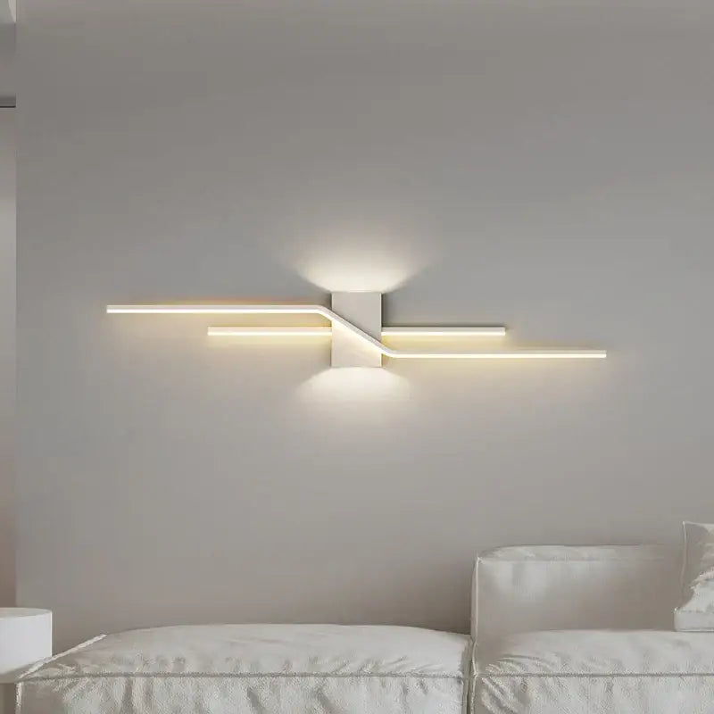 Modern white LED wall lamp with sleek angular design and warm ambient lighting for bedroom decorbites LED wall lamp