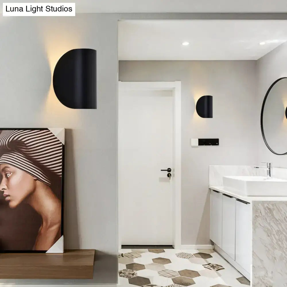 Black semi-circular wall sconce light with sleek modern design for bedroom ambient lighting in black grey finish