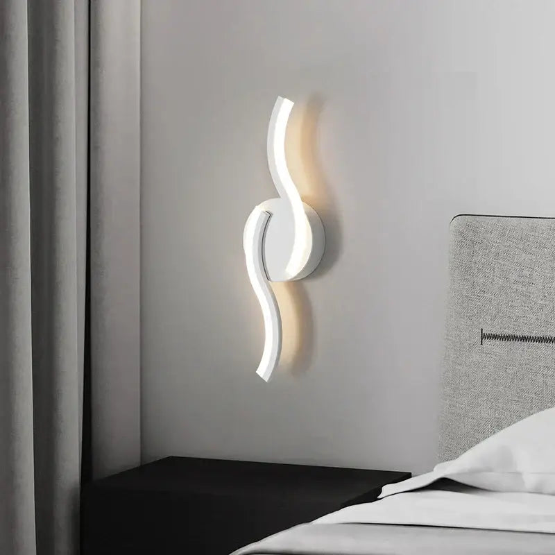 Modern curved white led wall sconces with a sleek design for bedroom lighting by decorbites led wall sconces
