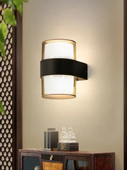 Modern cylindrical black led wall light with frosted glass diffuser and sleek metal band for decorbites led wall use
