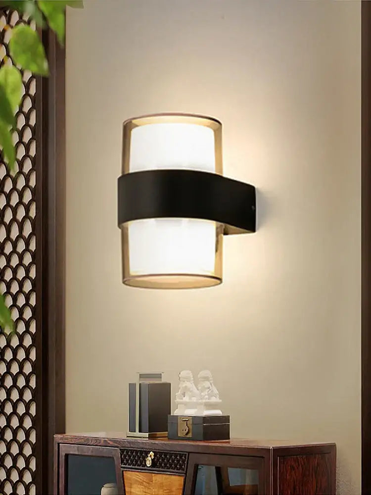 Modern cylindrical black led wall light with frosted glass diffuser and sleek metal band for decorbites led wall use