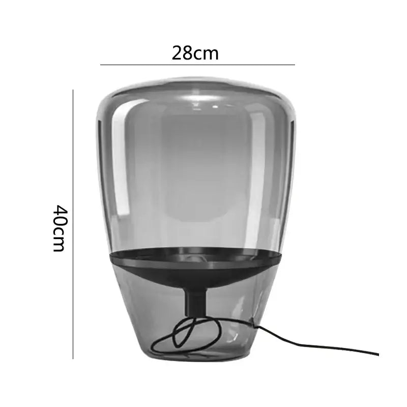 Modern gray translucent decorbites glass table lamp with sleek rounded design and black base for bedroom LED lighting