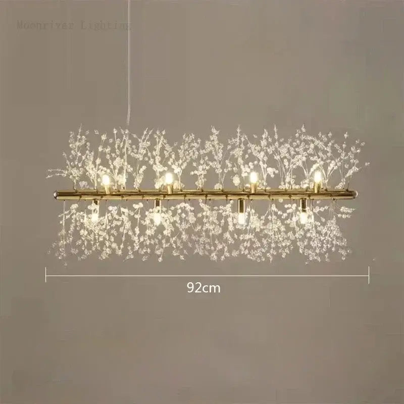 Modern decorbites dandelion crystal chandelier featuring gold-toned rectangular frame with illuminated crystal branches