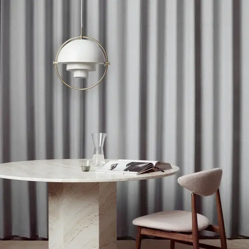 A modern white pendant light with circular gold and chrome frame for dining room contemporary interiors cord pendant installation