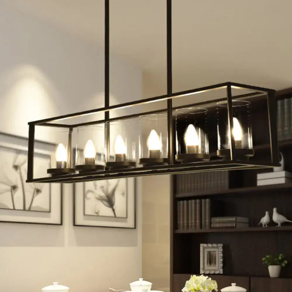 Black metal rectangular chandelier with clear glass shade and five illuminated candle-style bulbs for dining room lighting
