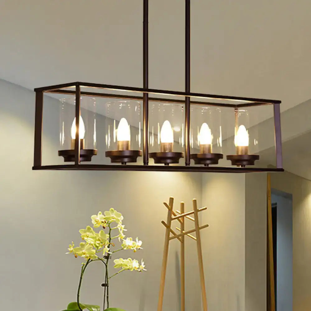 Modern rectangular pendant light with classic black island frame and clear glass shade housing five exposed bulbs