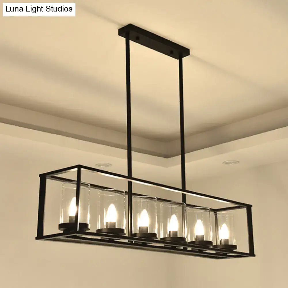 Black metal rectangular chandelier with five warm glowing bulbs and clear glass shade for classic black island lighting