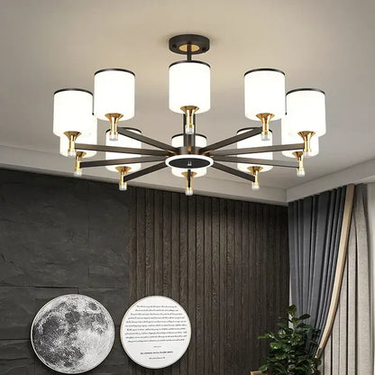 Modern dark bronze decorbites glass chandelier with eight white cylindrical shades and gold-toned metal arms for living room light