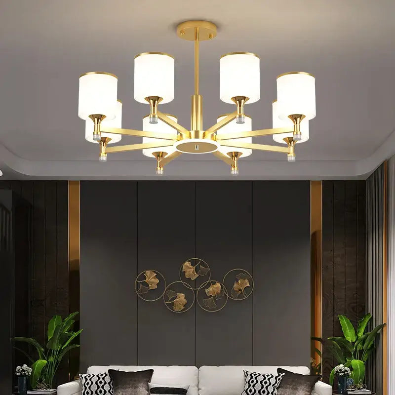 Modern dark bronze decorbites glass chandelier with gold-toned frame and eight white cylindrical glass shades for living room lighting