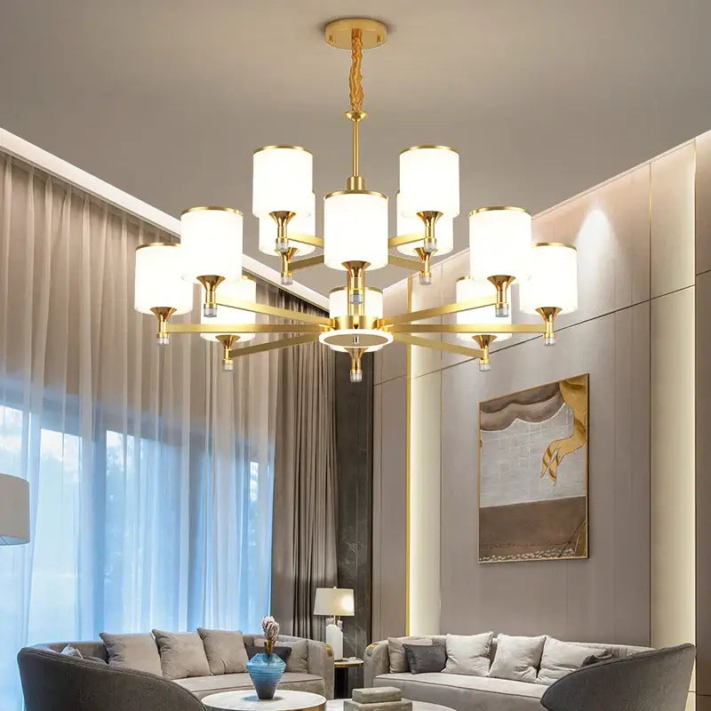 Modern dark bronze decorbites glass chandelier with gold-toned cylindrical shades and geometric design for living room light
