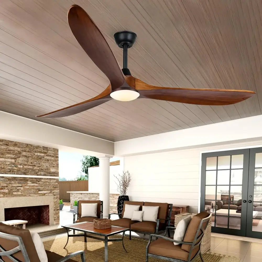 A modern ceiling fan with dark brown wood blades and a black hub featuring an integrated light for living room use