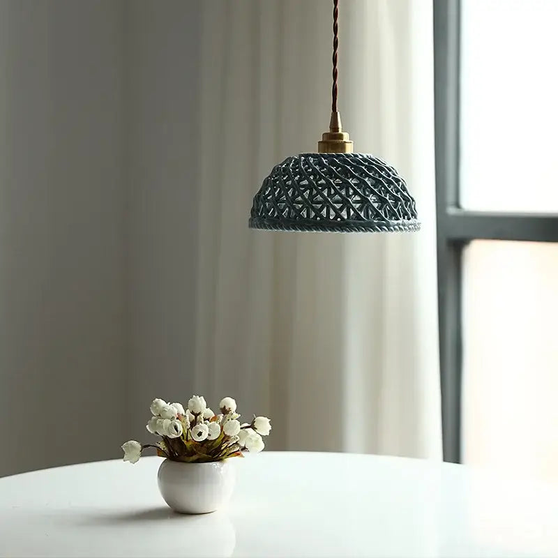 Modern dark gray ceramic led pendant lamp featuring a dark blue woven pendant lamp with brass fixture and twisted cord