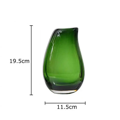 A sleek translucent emerald green glass vase with a teardrop shape ideal for modern double glass vase hydroponic decor