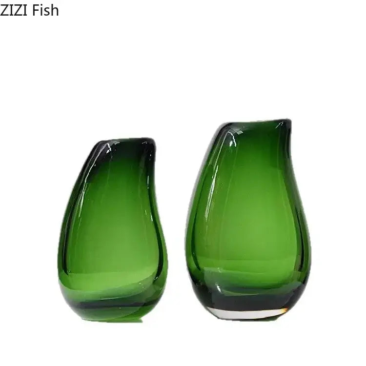 Two translucent green glass vases with a glossy finish in a modern dark gray double glass vase hydroponic desk decor