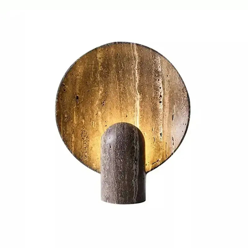 A modern dark travertine rock led table lamp with textured earthy tones and warm amber glow for bedroom use