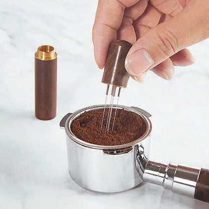 Modern dark wood espresso coffee stirrer with metal tines needle distributor pressing ground coffee in portafilter