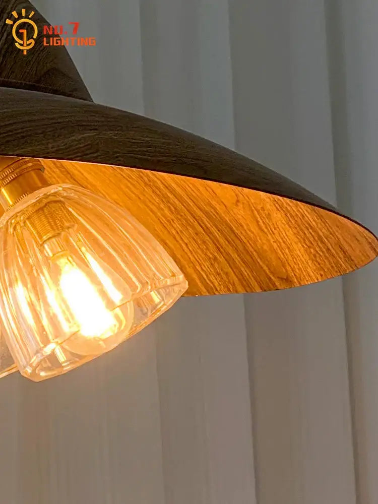Modern dark wood iron art decorbites iron art pendant lights featuring warm-toned wood and amber-gold textured interior for dining room