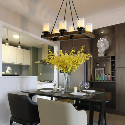 Modern dark wood island chandelier with six white glass shades emitting warm light for dining room use