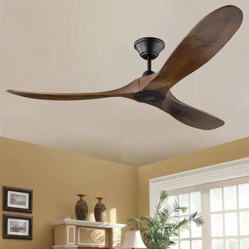 Modern ceiling fan with three large dark wood blades and black hub featuring remote control for living room use