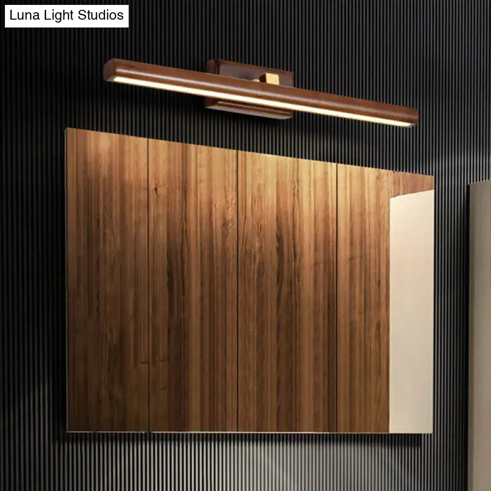 Modern dark wood linear wall sconce with warm-toned wooden vanity light and integrated led strip for bathroom use