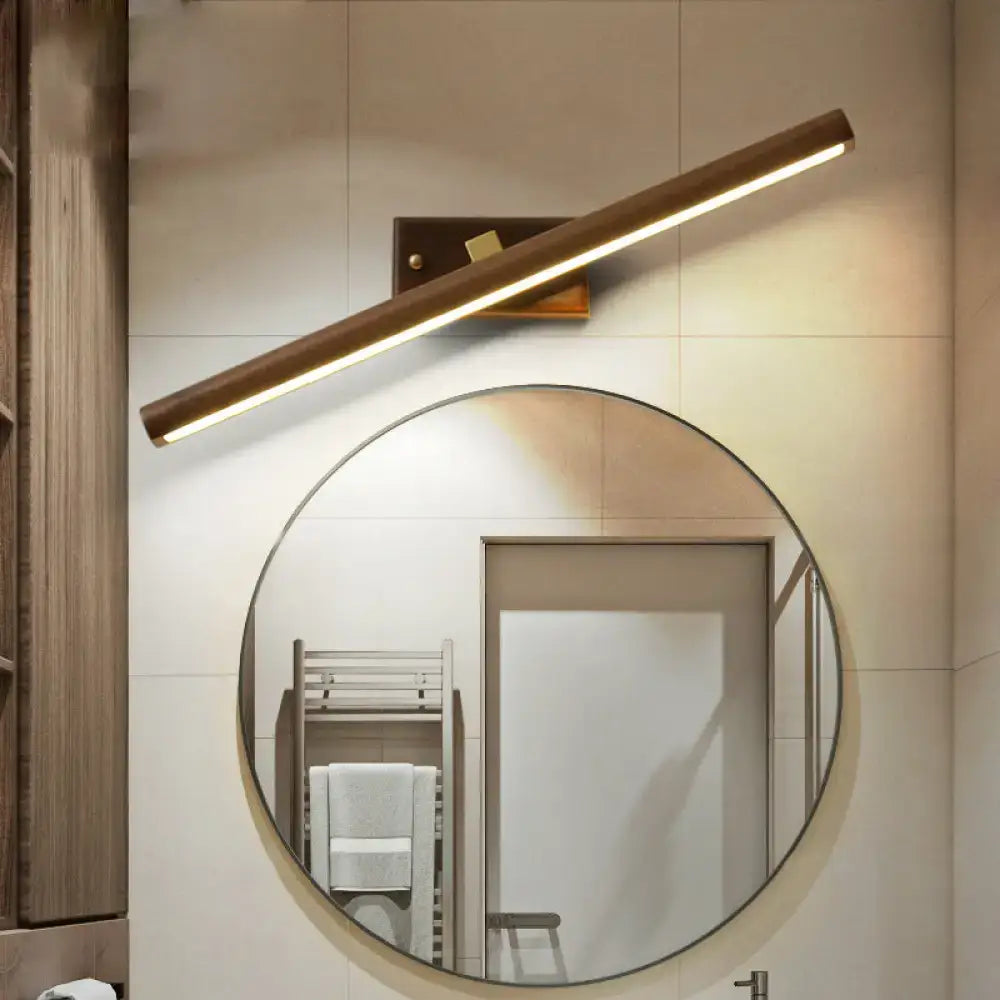 Modern dark wood linear wall sconce with wooden finish and warm ambient lighting for bathroom vanity use