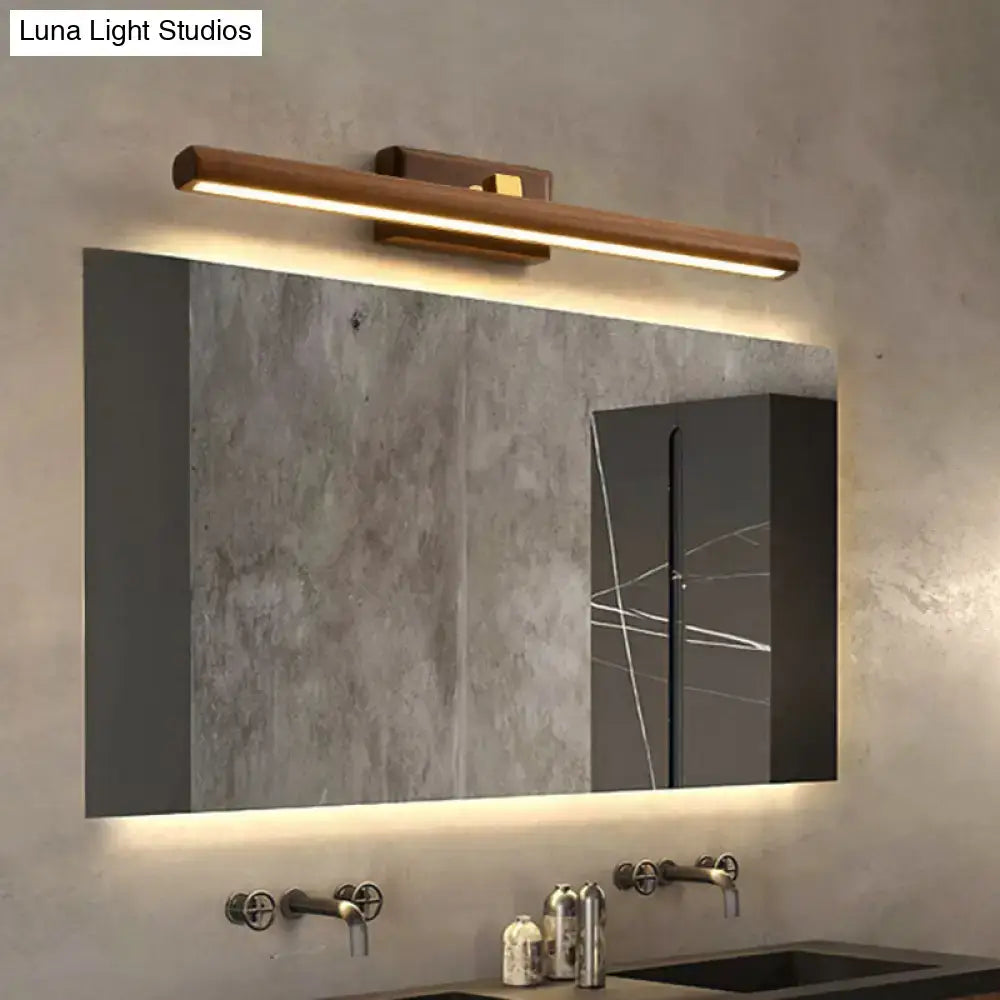 Modern dark wood linear wall sconce bathroom vanity light with sleek minimalist design and warm led illumination