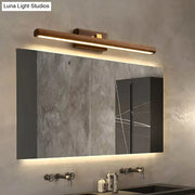 Modern dark wood linear wall sconce bathroom vanity light with sleek minimalist design and warm led illumination