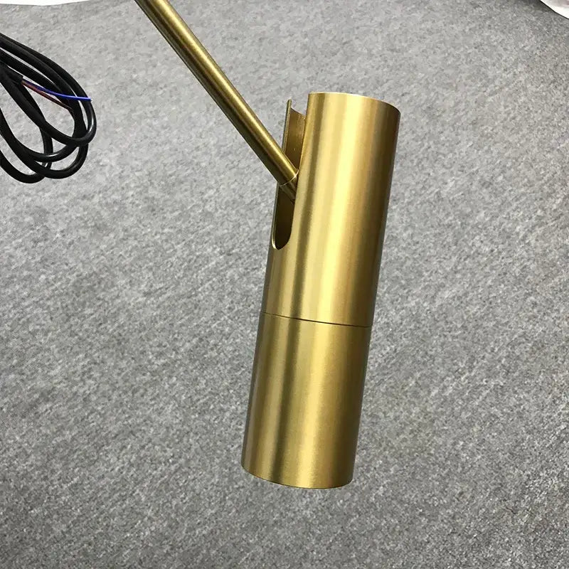 Brass-finished cylindrical wall-mounted lamp with angled arm in decorbites black chandelier adjustable spotlight pendant