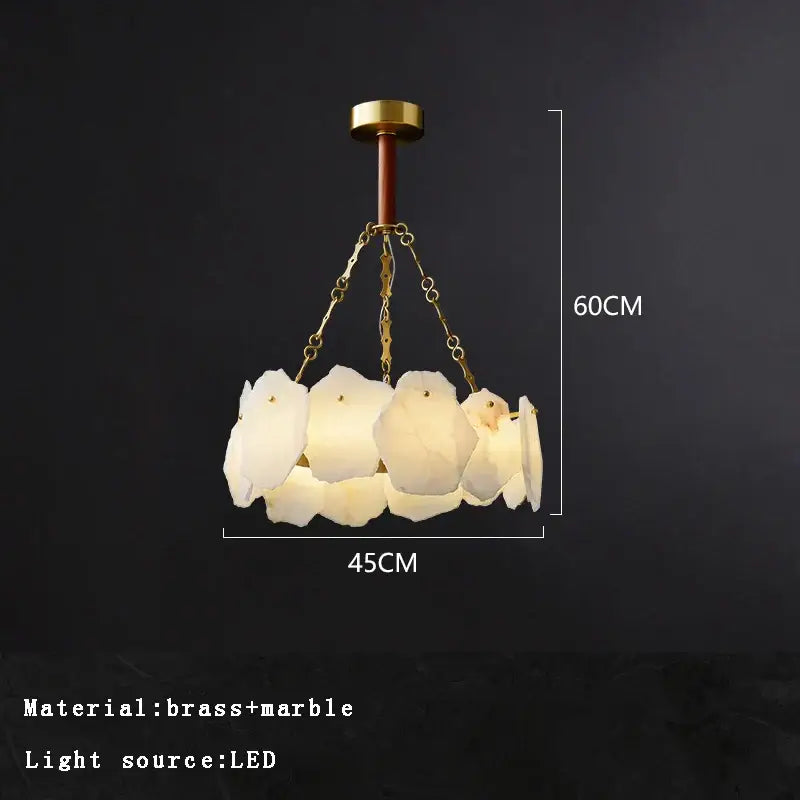 A modern decorbites brass marble ceiling chandelier with five illuminated marble bird-shaped shades for dining room lighting