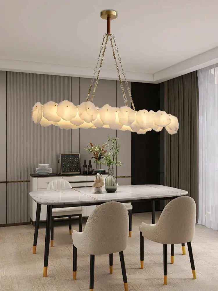Modern decorbites brass marble ceiling chandelier with cloud-like white glass orbs suspended by gold-toned chains