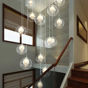 Clear glass bubble led chandelier with warm white bulbs by decorbites for modern dining room lighting