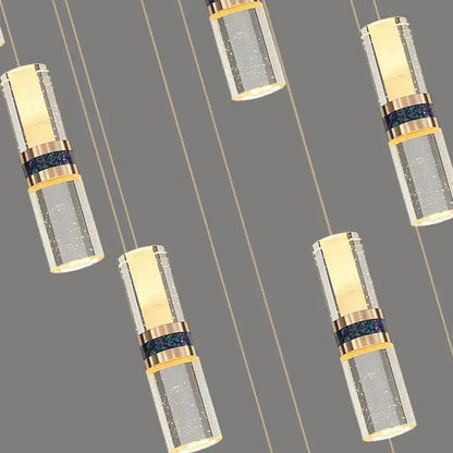 Modern decorbites crystal columnar chandelier with gold-toned metal and clear glass for stairway lighting