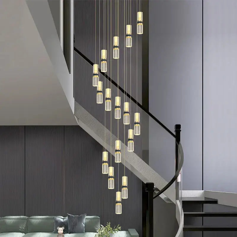Modern decorbites crystal columnar chandelier with clear glass cylinders and gold-toned accents for stairway lighting