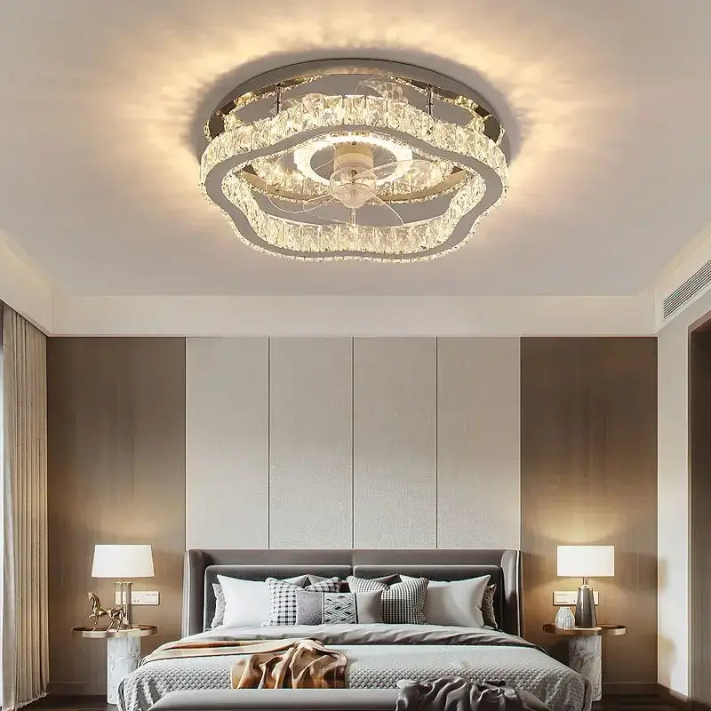 A modern decorbites crystal led ceiling fan with clear crystal tiers and central motor for bedroom lighting