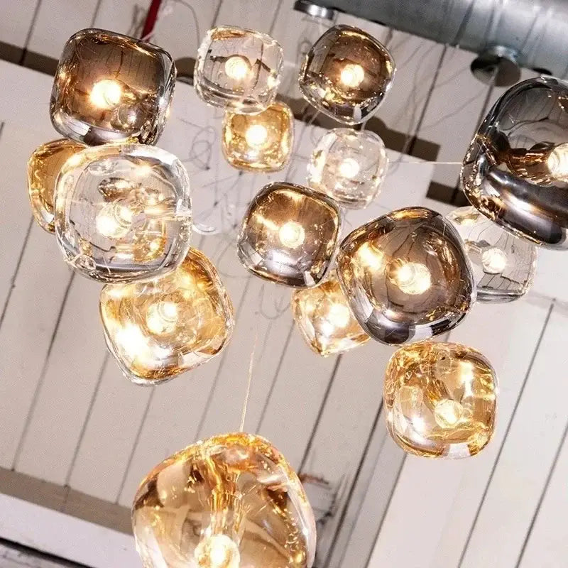 Modern decorbites crystal led chandelier with amber and clear glass orbs featuring warm LED bulbs for living room use
