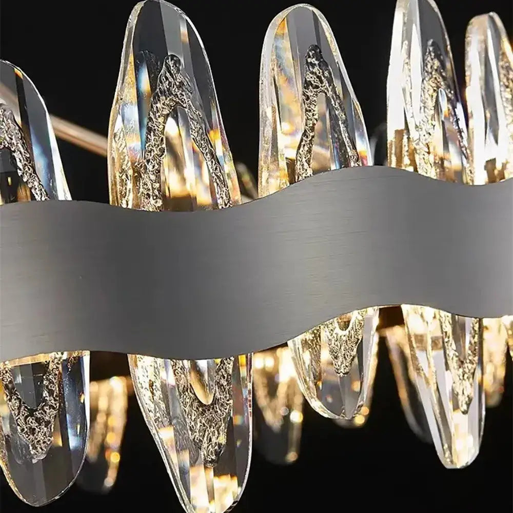 Modern decorbites crystal led chandelier with clear faceted crystal droplets and gold leaf on silver wave frame for living room