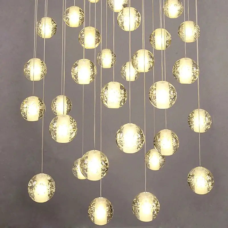 Modern decorbites crystal led chandelier with frosted glass orbs and warm internal lighting for living room pendant light