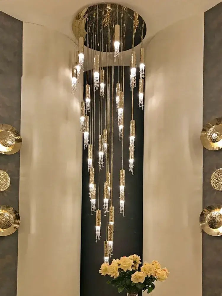 Golden cylindrical chandelier with crystal accents from decorbites crystal led large staircase collection for living rooms