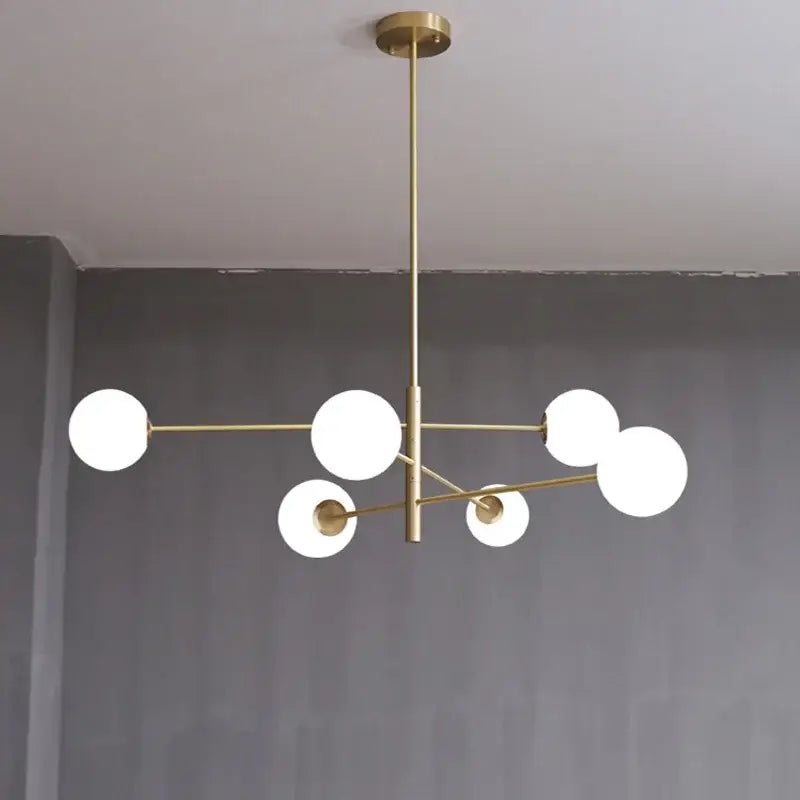 Modern decorbites glass brass chandelier with six frosted glass spheres in a geometric branching design for living room