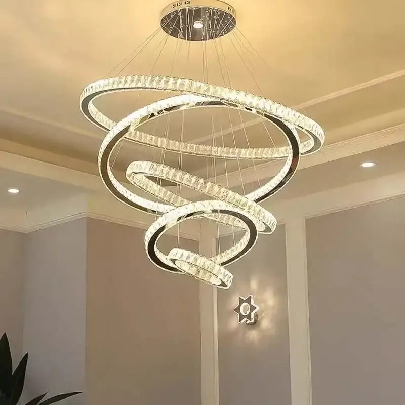 Modern decorbites gold rings crystal chandelier with interlocking gold rings and crystal accents for staircase lighting