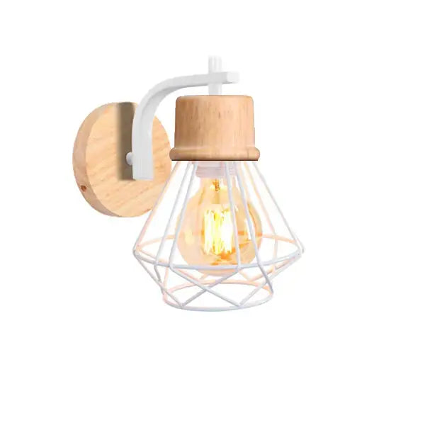 A rustic decorbites iron white wall lamp with iron white cage and wood sconce housing an exposed filament bulb