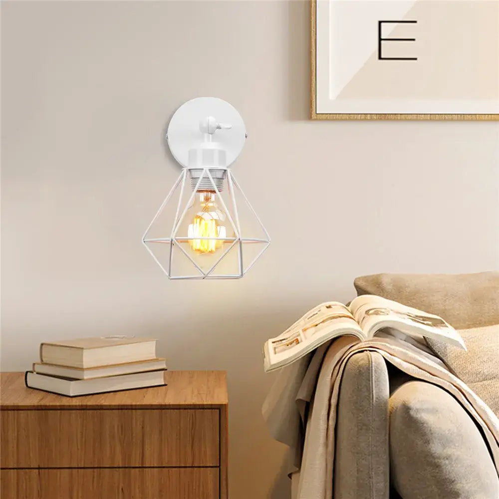 White geometric iron white cage wall lamp with exposed filament bulb for modern decorbites bedroom sconce