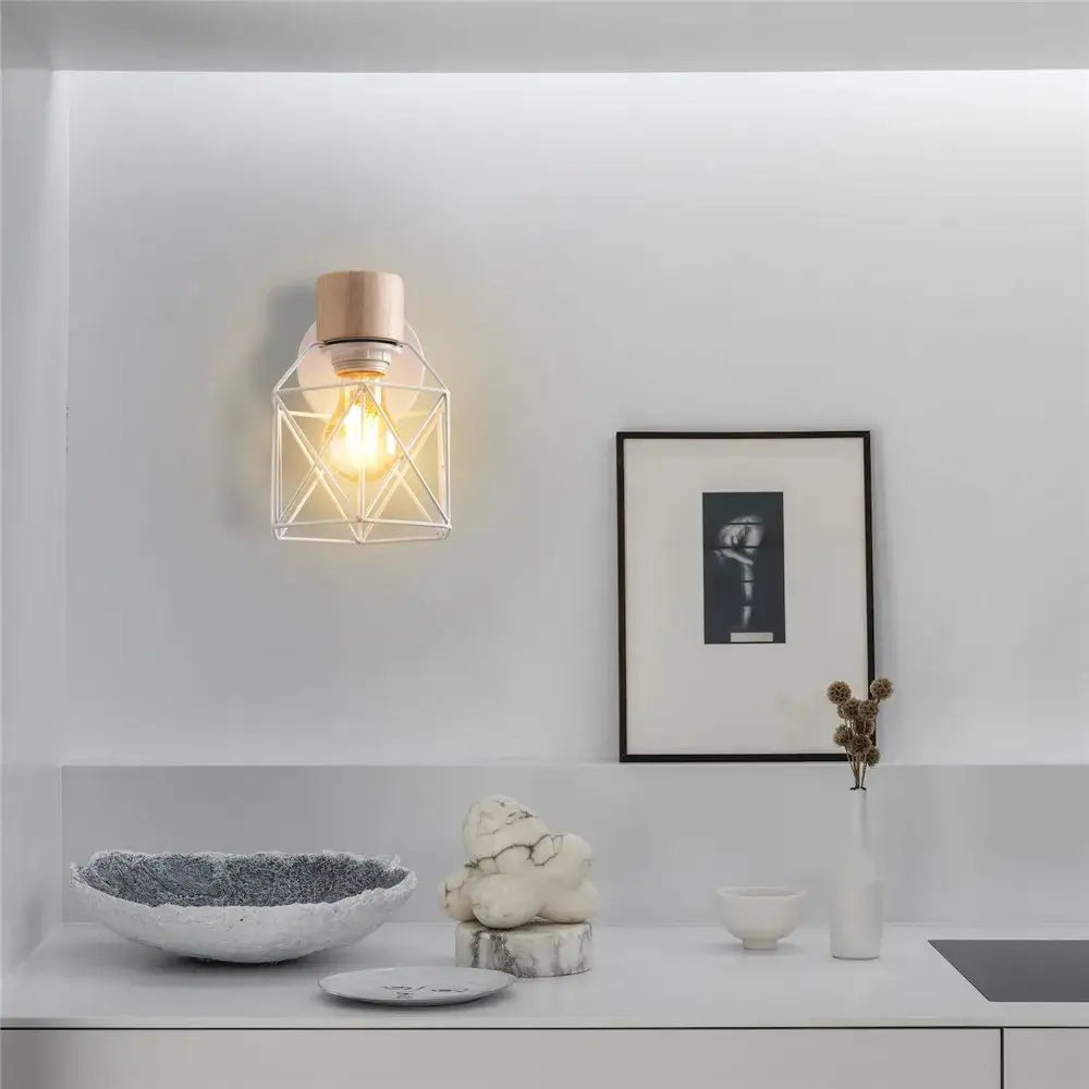 A modern wall lamp with copper-finished base and clear glass cage featuring decorbites iron white cage design
