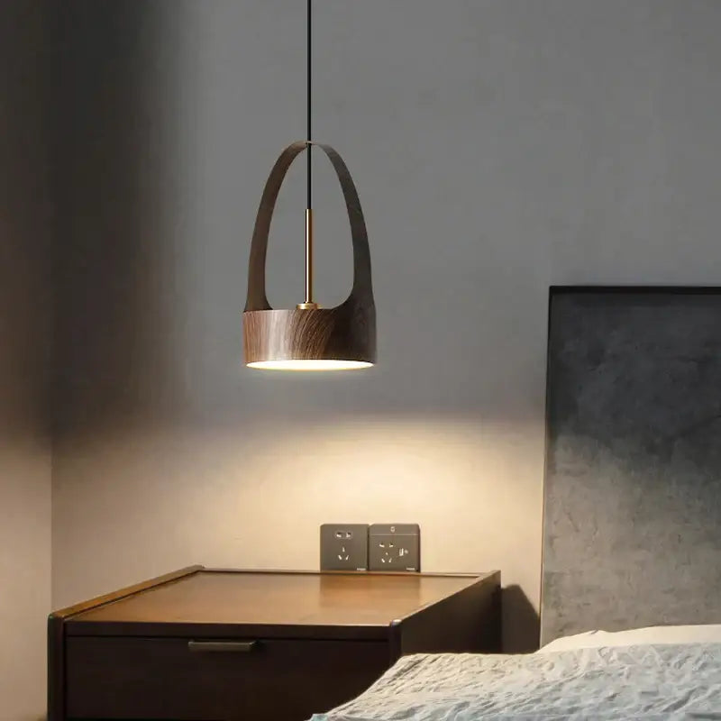A modern decorbites led wood grain chandelier pendant light with dark wood finish and brass accents casting warm light