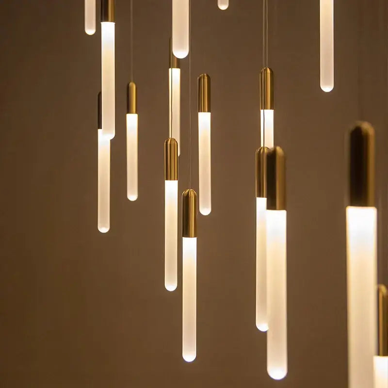 Modern decorbites luxe gold tube chandelier with frosted glass and brass accents for dining room lighting