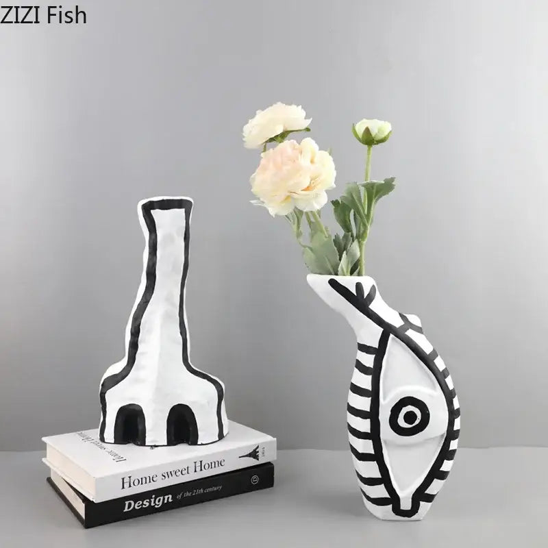 White ceramic fish-shaped vase with black geometric patterns and eye design from decorbites abstract vase set for modern design