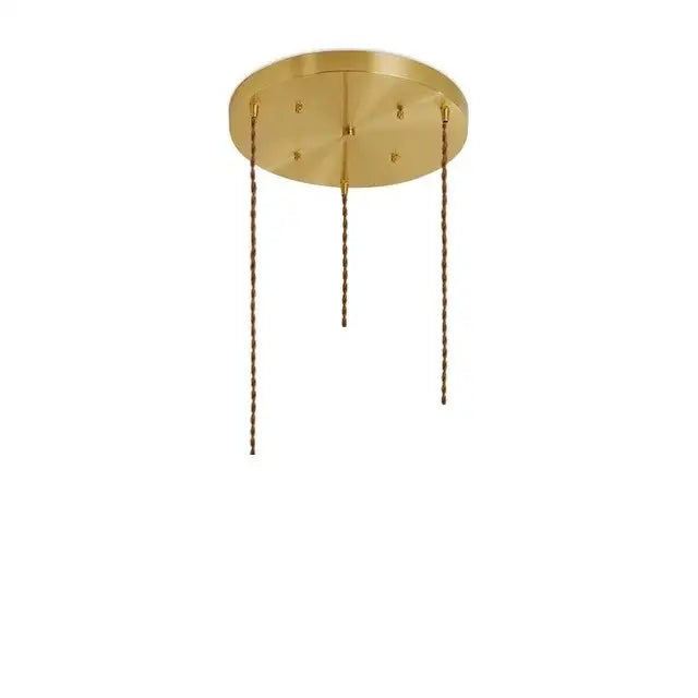 Brass-finished modern pendant lights with diamond amber glass and three twisted chain suspensions for dining room