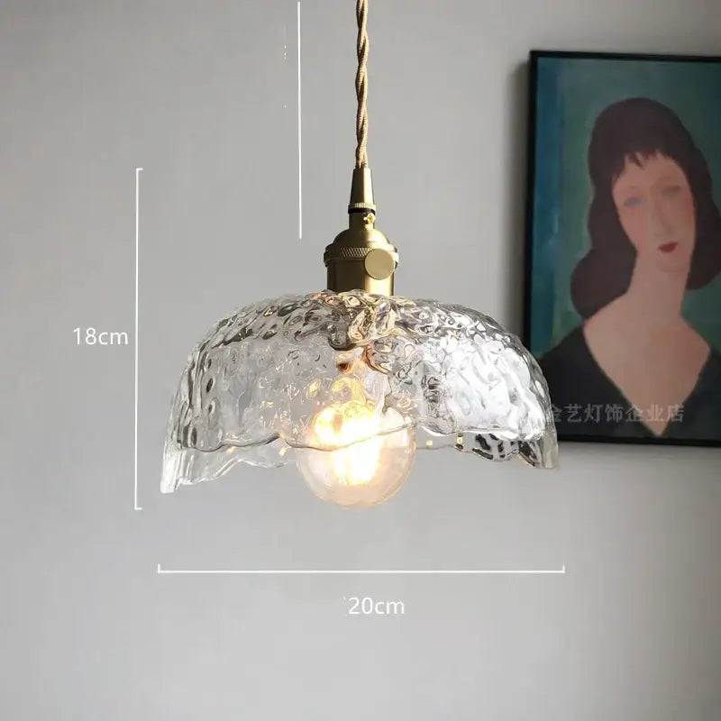 Modern diamond amber glass pendant lights featuring clear textured glass and brass fixture with twisted cord for dining room
